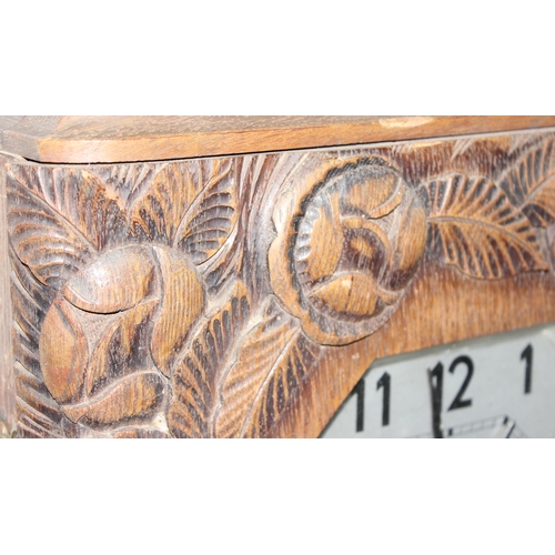 1334 - Large French oak cased Art Deco wall clock with carved details, approx 73cm H x 38cm W x 17cm D