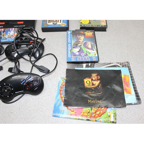 1541 - Sega Megadrive console, 4 controllers, 7 games and various manuals