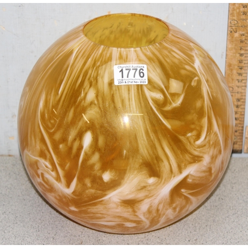 1776 - A large butterscotch coloured spherical glass vase, approx 26cm tall