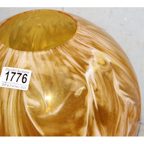 1776 - A large butterscotch coloured spherical glass vase, approx 26cm tall