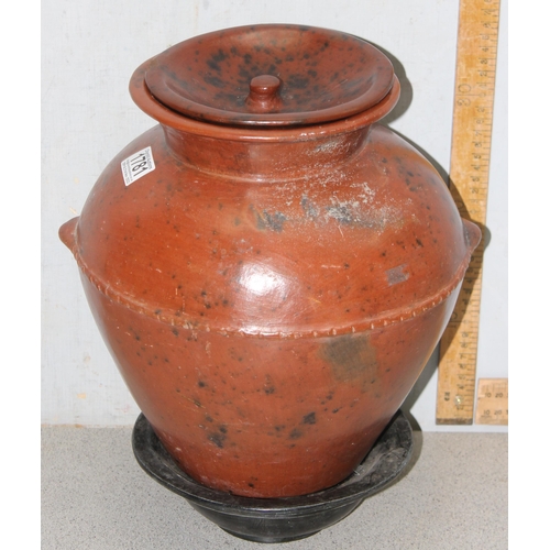 1781 - Low fired African earthenware cooking pot with associated stand, approx 36cm tall