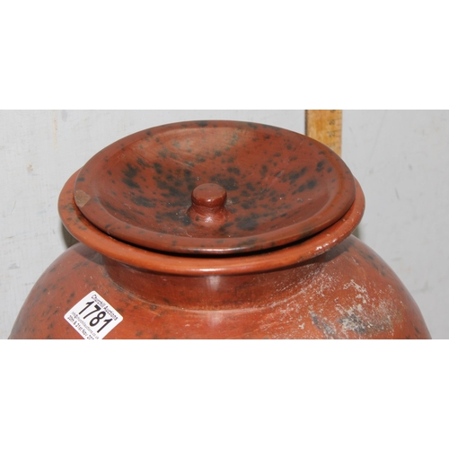 1781 - Low fired African earthenware cooking pot with associated stand, approx 36cm tall