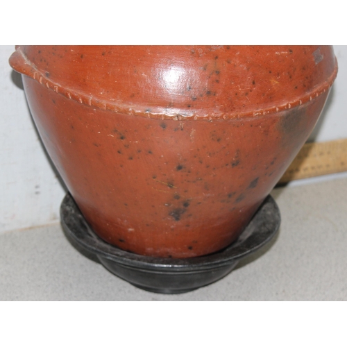 1781 - Low fired African earthenware cooking pot with associated stand, approx 36cm tall