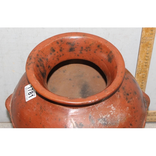 1781 - Low fired African earthenware cooking pot with associated stand, approx 36cm tall