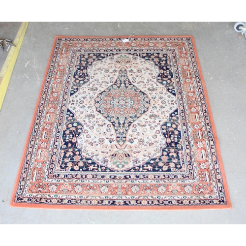 212 - 20th Century salmon ground rug approx. 162cm x 125cm