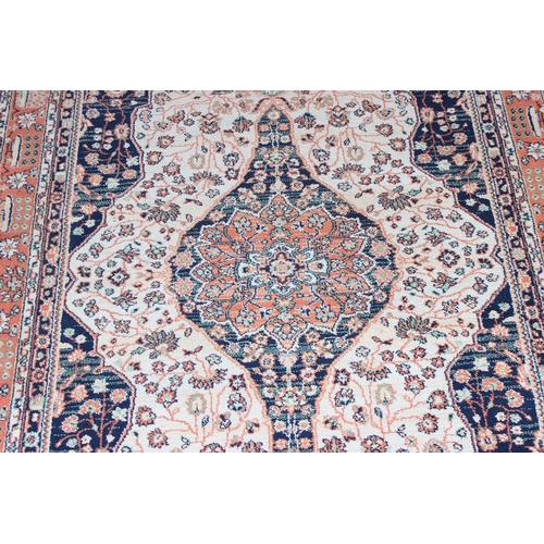 212 - 20th Century salmon ground rug approx. 162cm x 125cm