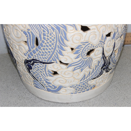 318 - Blue and white ceramic garden seat, decorated with Chinese dragons, approx 45cm tall