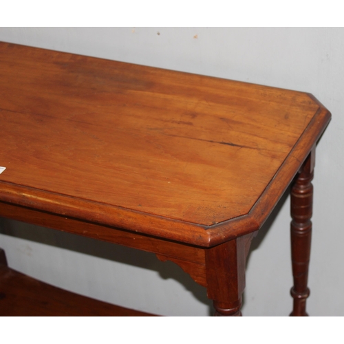 135 - An Edwardian mahogany hall table with turned legs and undertier, approx 85cm wide x 46cm deep x 76cm... 