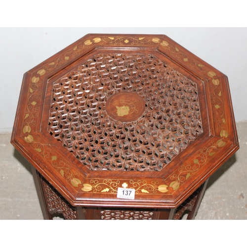 137 - An Indian hard wood folding tea table with brass inlay, approx 56cm wide x 50cm tall