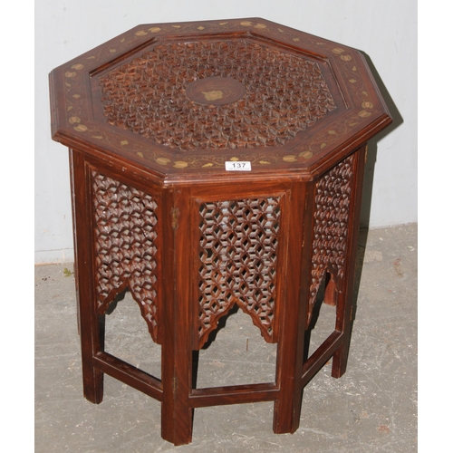 137 - An Indian hard wood folding tea table with brass inlay, approx 56cm wide x 50cm tall