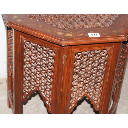 137 - An Indian hard wood folding tea table with brass inlay, approx 56cm wide x 50cm tall