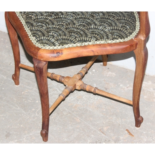 139 - A 19th century corner chair with carved frame and scalloped upholstery