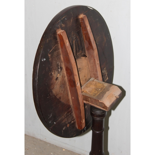 141 - A small antique mahogany tilt topped wine table, approx 45cm wide x 45cm deep x 70cm tall