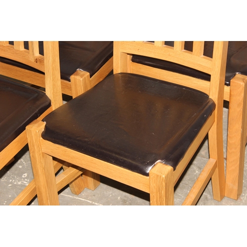 142 - A set of 4 good quality modern light oak and leather dining chairs