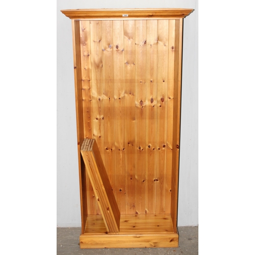 143 - A large pine bookcase, approx 90cm wide x 40cm deep x 190cm tall