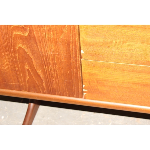 4 - A retro mid-century sideboard, possibly by Jentique but seemingly unmarked, 3 drawers flanked by 2 c... 