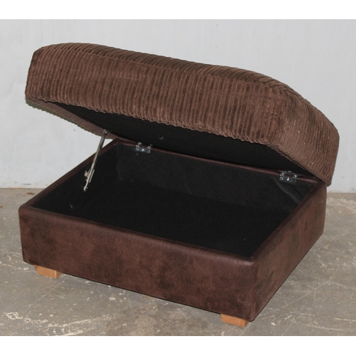 146 - A vintage brown leather and fabric topped ottoman or foot stool