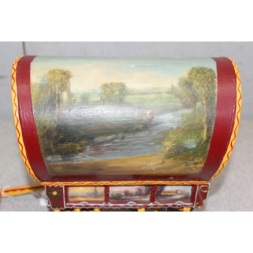 1562 - A vintage hand painted model of a wooden gypsy caravan, approx 34cm long