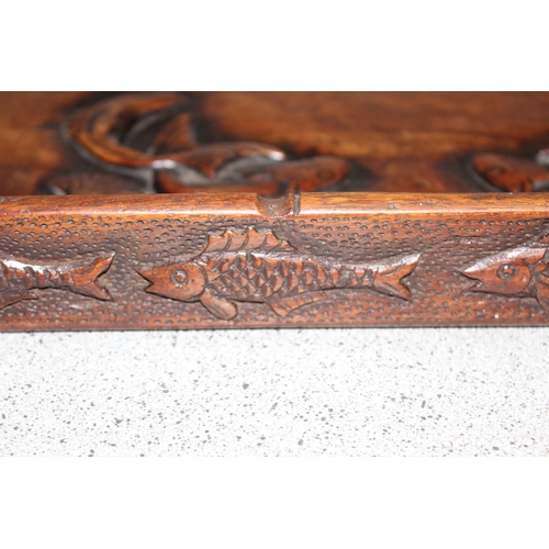 1802 - A vintage Oriental carved wooden tray depicting fish, approx 34cm square