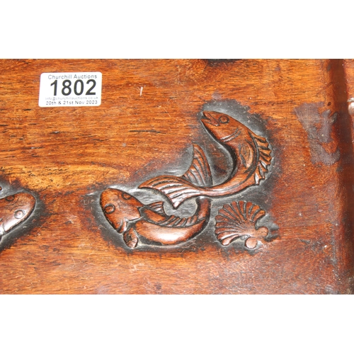 1802 - A vintage Oriental carved wooden tray depicting fish, approx 34cm square