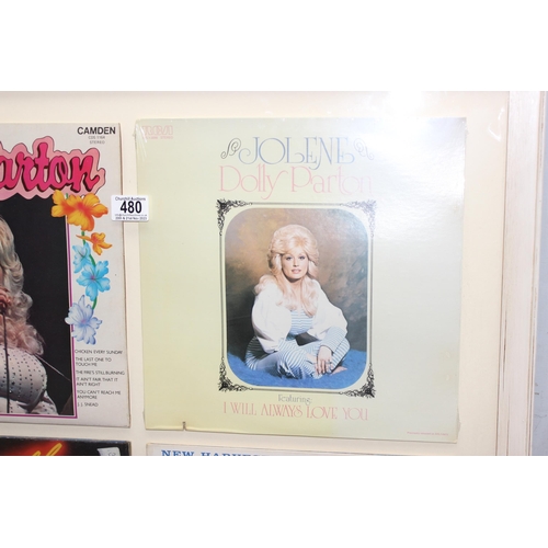 480 - A framed display of 4 Dolly Parton vinyl record sleeves, unchecked if records are present, approx 78... 