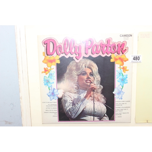 480 - A framed display of 4 Dolly Parton vinyl record sleeves, unchecked if records are present, approx 78... 