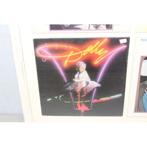 480 - A framed display of 4 Dolly Parton vinyl record sleeves, unchecked if records are present, approx 78... 