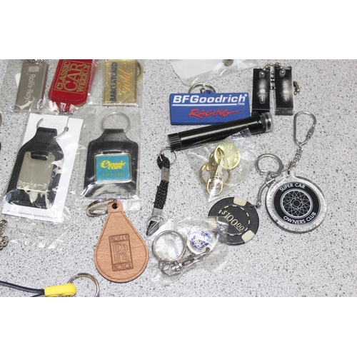 749 - Qty of assorted motoring related items mainly keyrings and badges etc