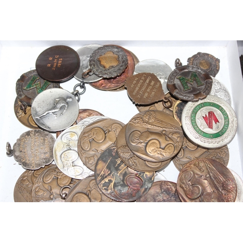 749A - A large qty of assorted fobs, medals a plaques, mainly motoring and cycling related, largely 1950's