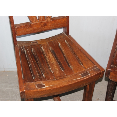 153 - A pair of unusual wooden chairs formed from vintage cartwheels