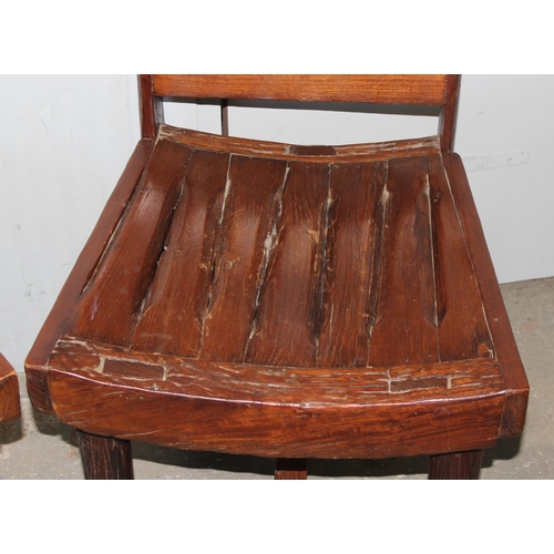 153 - A pair of unusual wooden chairs formed from vintage cartwheels