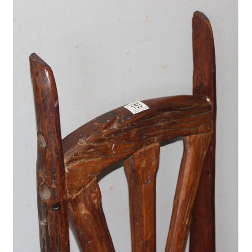 153 - A pair of unusual wooden chairs formed from vintage cartwheels