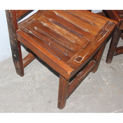 153 - A pair of unusual wooden chairs formed from vintage cartwheels