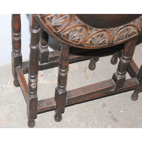 154 - A small vintage oak drop leaf table with carved border, approx 100cm wide x 60cm deep x 74cm tall