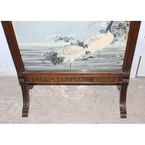 155 - An antique mahogany framed fire screen with a Japanese style hand painted on fabric scene of crane b... 