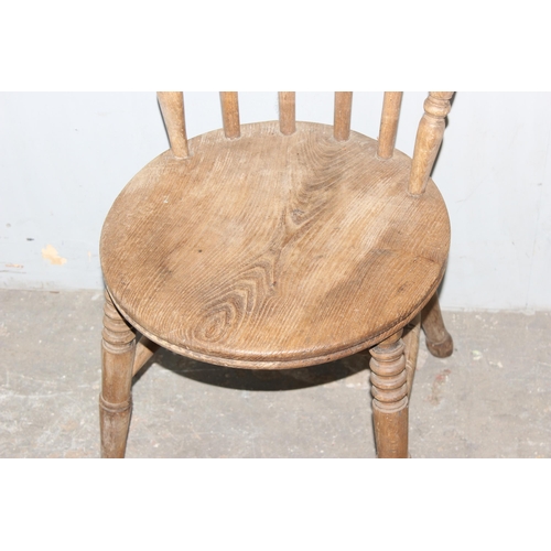 156 - An antique penny seated chair with stick back