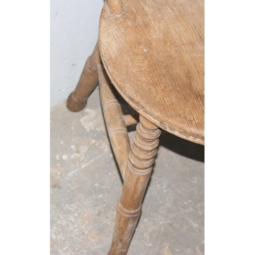 156 - An antique penny seated chair with stick back