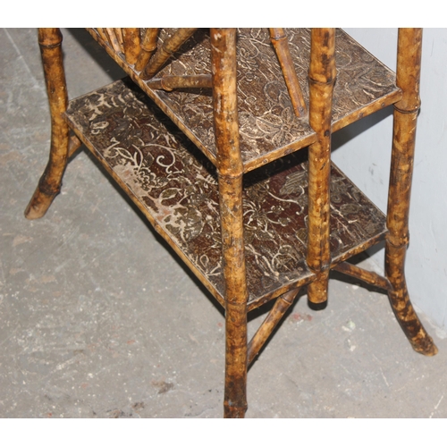 161 - A late 19th century Aesthetic Movement bamboo and rattan what not magazine rack, approx 43cm wide x ... 