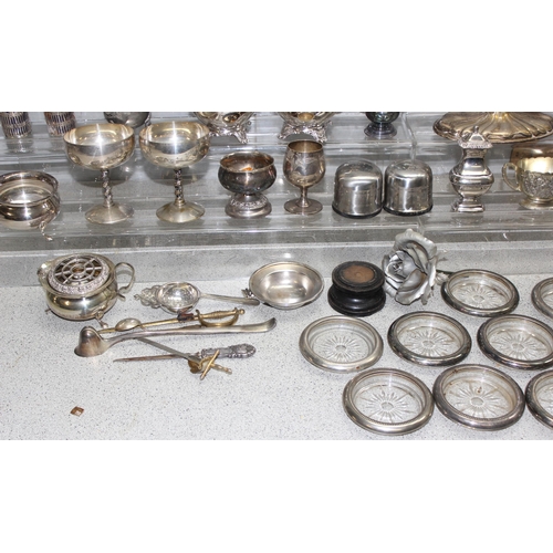 1011 - A large qty of assorted mixed metalware, mainly silver plate with some pewter to inc a 5 branch cand... 