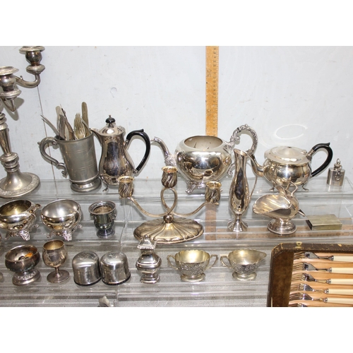 1011 - A large qty of assorted mixed metalware, mainly silver plate with some pewter to inc a 5 branch cand... 