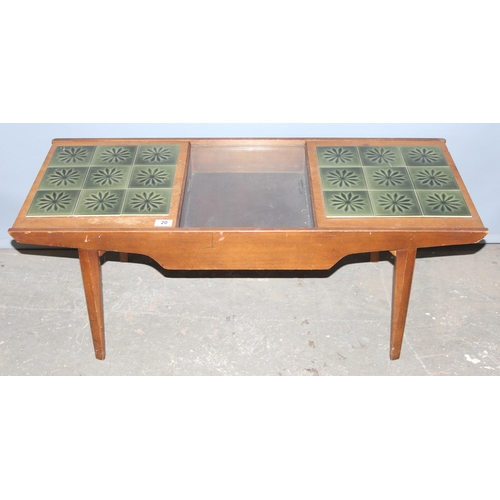 20 - A retro Lebus Link green tile topped coffee table with storage, approx 105cm wide x 43cm deep x 41cm... 