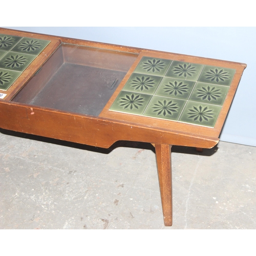 20 - A retro Lebus Link green tile topped coffee table with storage, approx 105cm wide x 43cm deep x 41cm... 