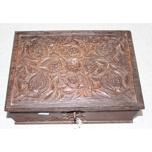 274 - Carved oak box with floral decorated approx. 26cm x 19cm x 9cm with working key