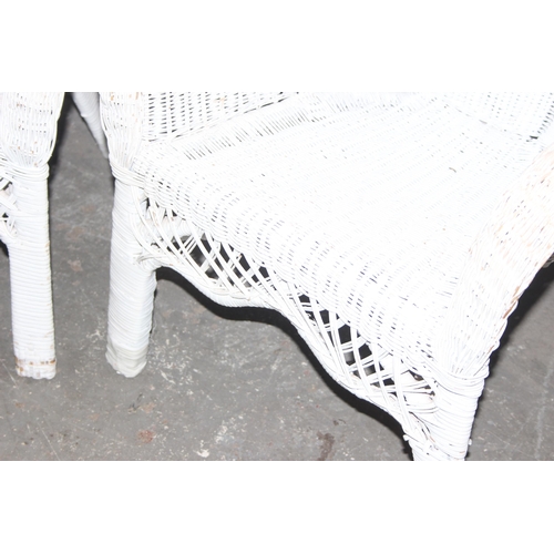 301 - A pair of vintage white painted wicker conservatory chairs