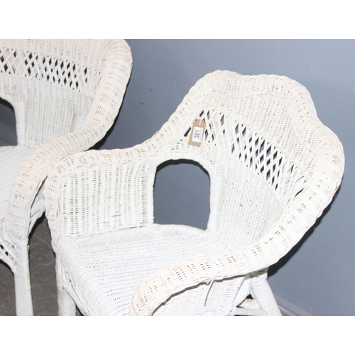 301 - A pair of vintage white painted wicker conservatory chairs