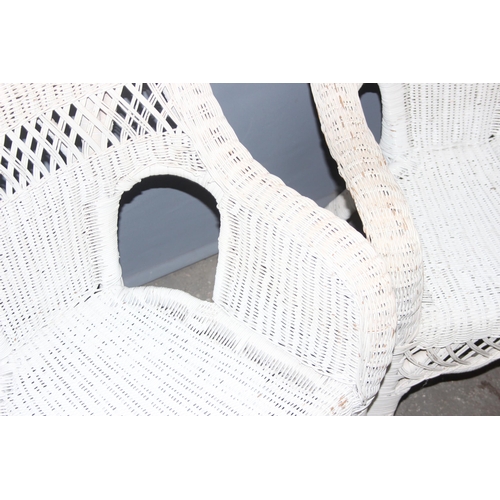 301 - A pair of vintage white painted wicker conservatory chairs