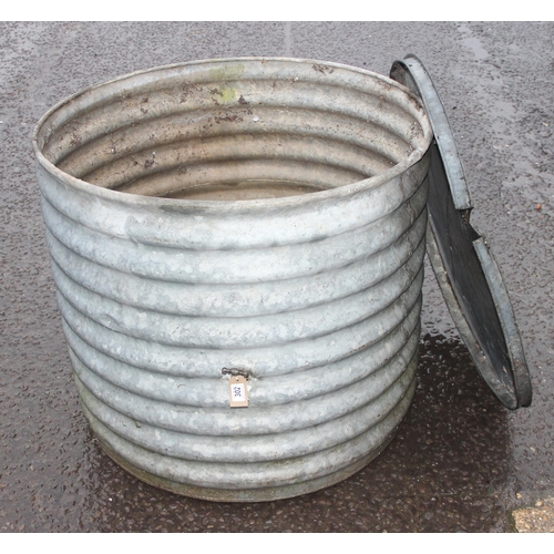 302 - A large vintage ridged galvanised metal tub with tap and lid, approx 91cm wide x 91cm deep x 80cm ta... 