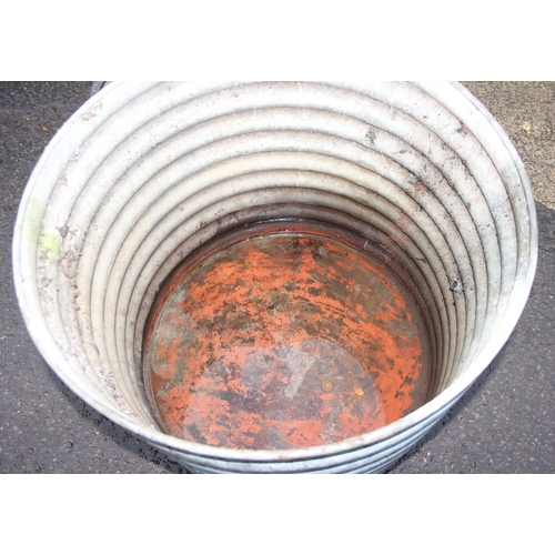 302 - A large vintage ridged galvanised metal tub with tap and lid, approx 91cm wide x 91cm deep x 80cm ta... 