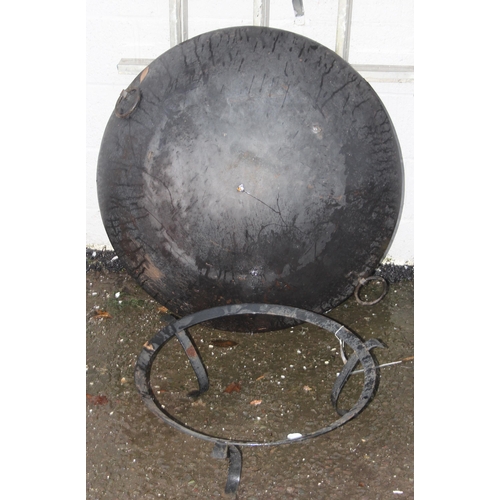 304 - A large garden fire pit or brazier on stand, approx 95cm in diameter