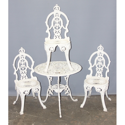 306 - A vintage Coalbrookdale style set of 3 white painted garden chairs and a matching table, all alumini... 